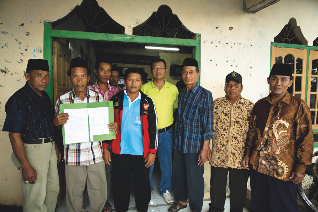 Villagers with documentation of the protected mangrove zone.